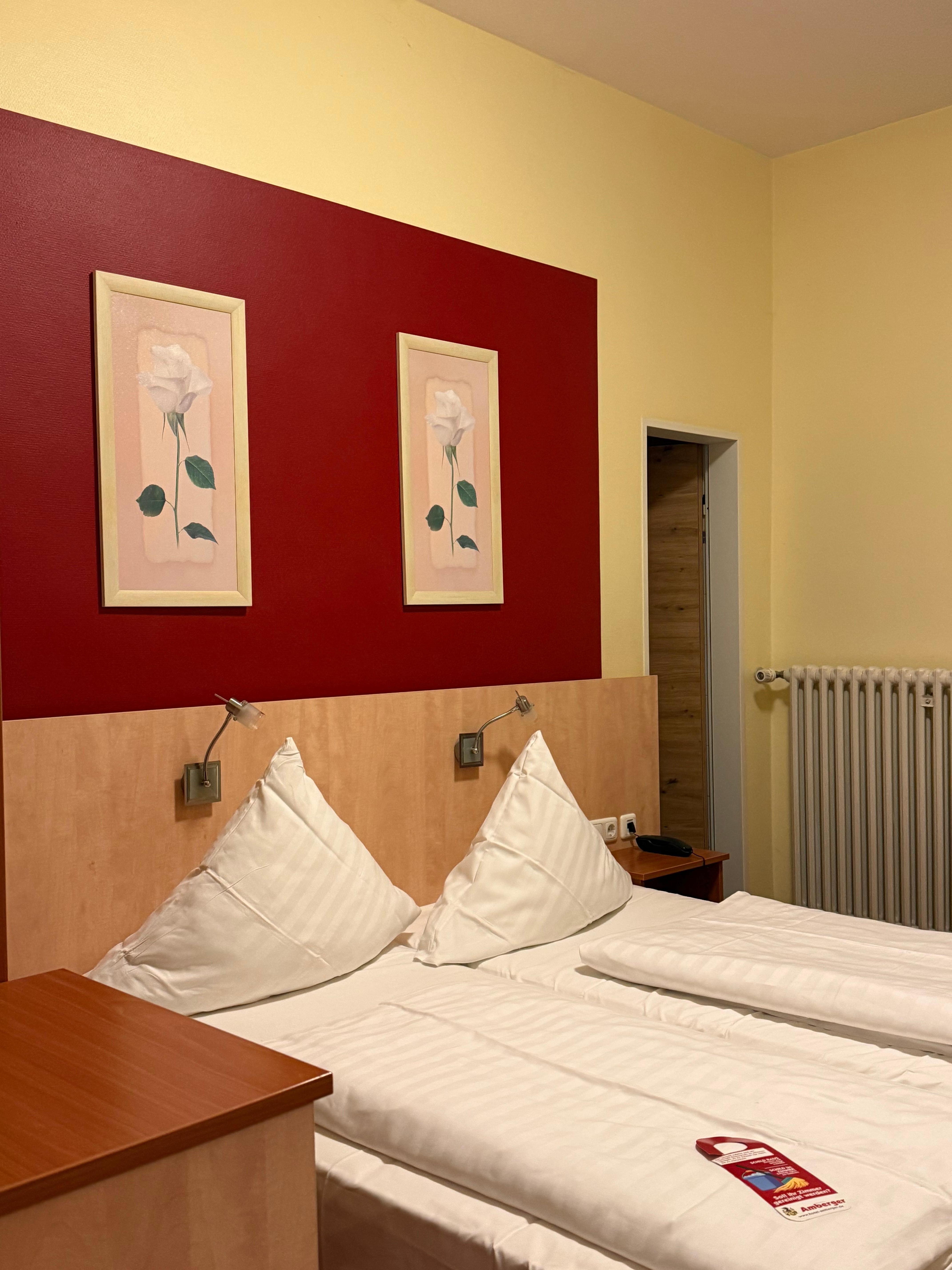 Reading lamps located dangerously low and on top of pillow. 