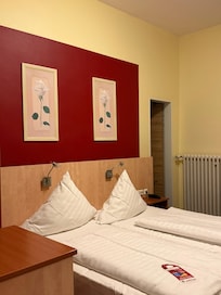 Reading lamps located dangerously low and on top of pillow.