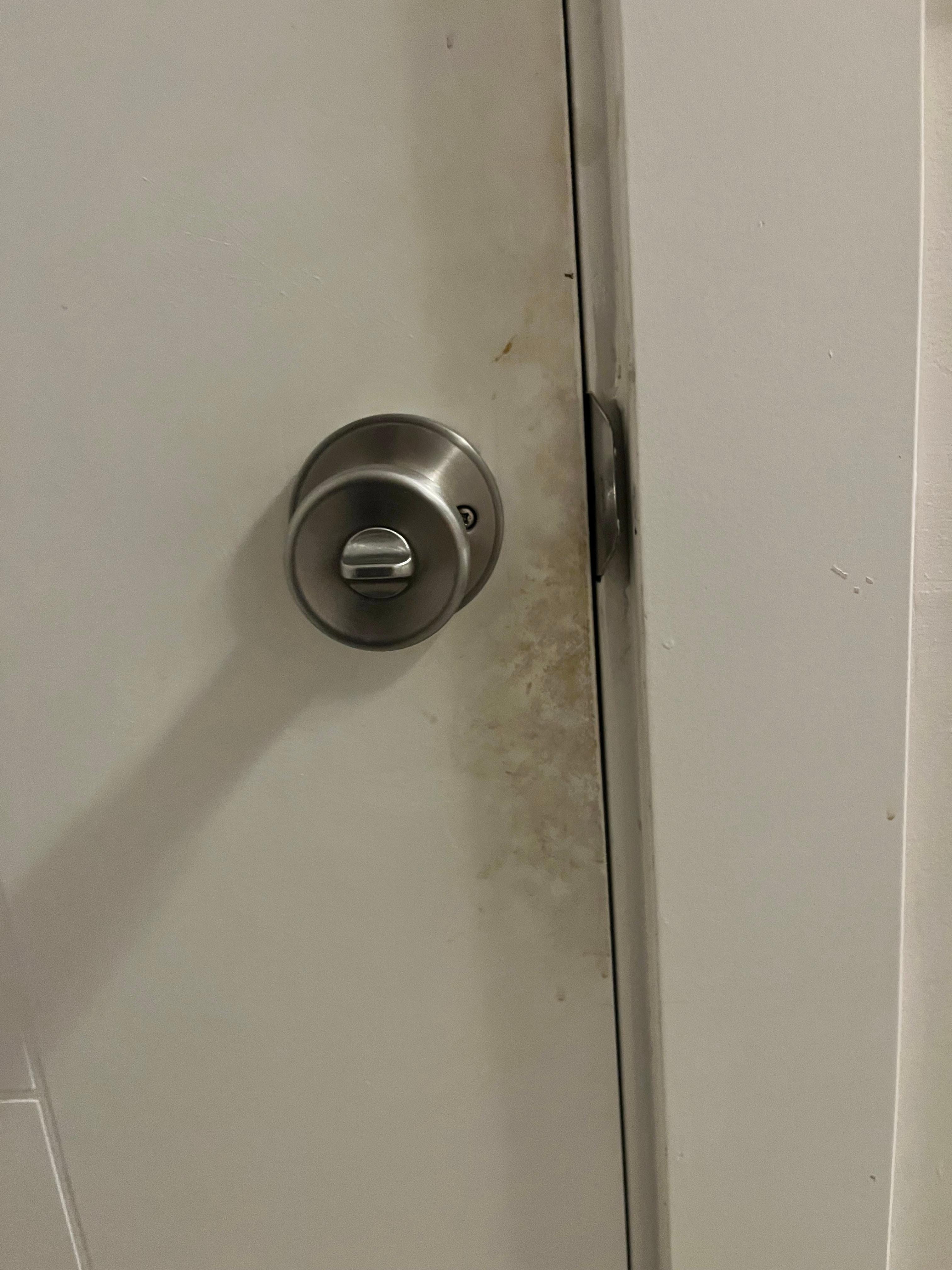 Greasy black door to room