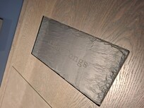 Slate on the desk for hot tongs