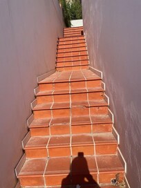 Broken tiles on steps and dirty