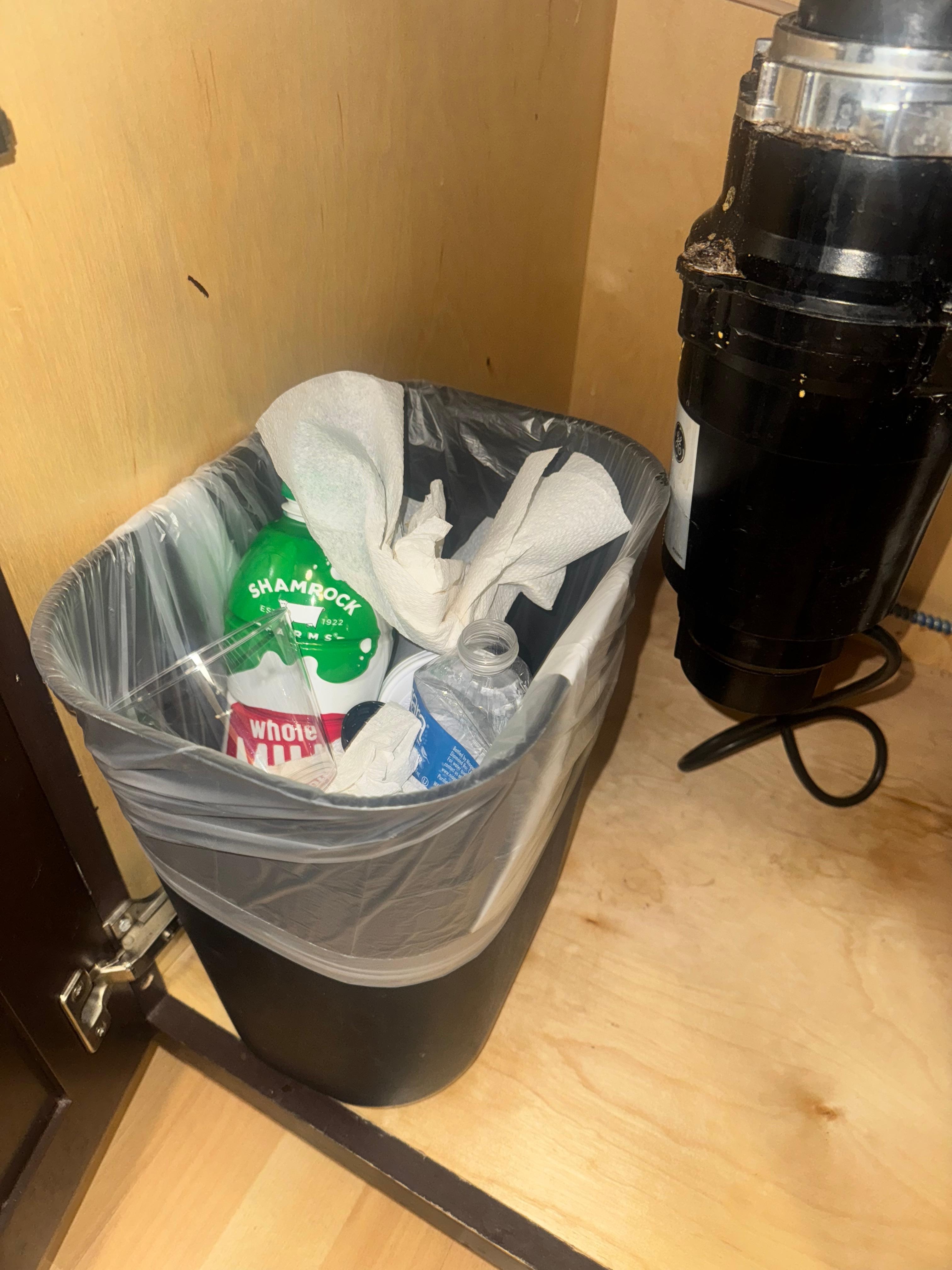 The can full of past guest trash when we first entered the room