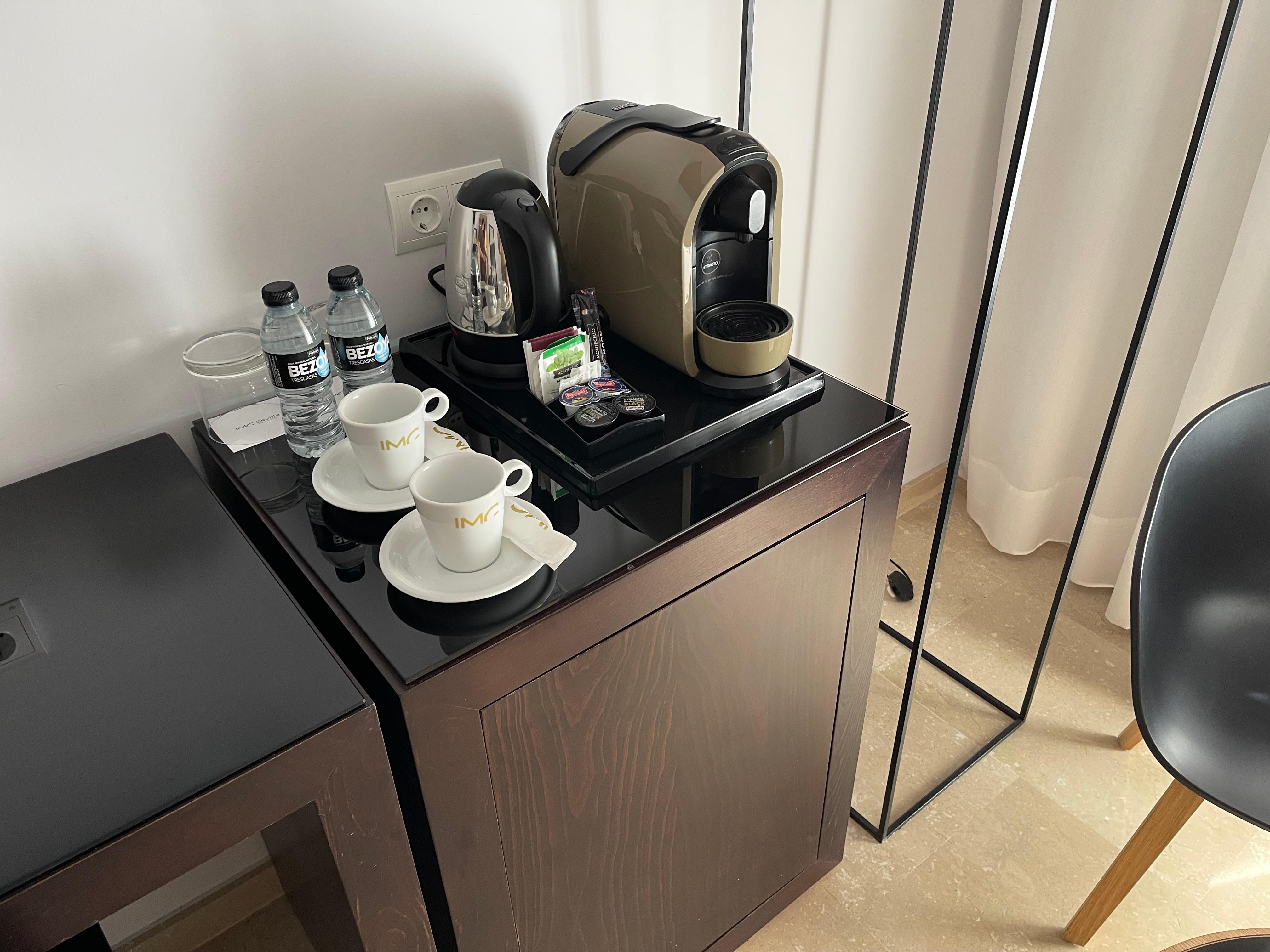 Kettle, Coffee maker, 2 bottles of water daily, small fridge