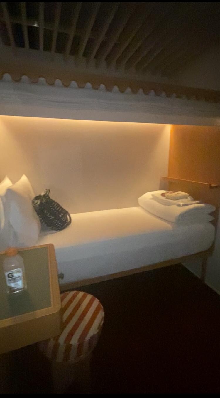 Inside one room. Could cross from bed to wall in three steps. Comfy and cozy. 