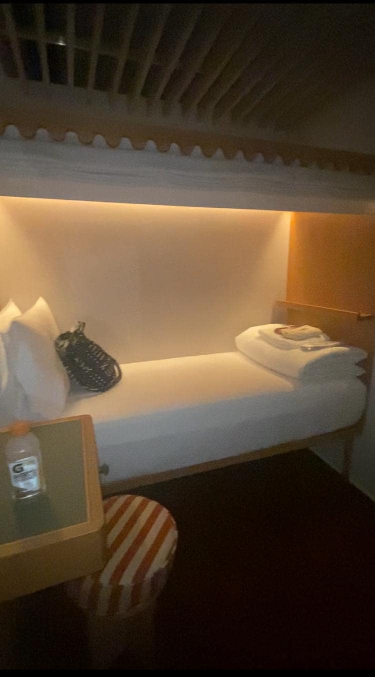 Inside one room. Could cross from bed to wall in three steps. Comfy and cozy.