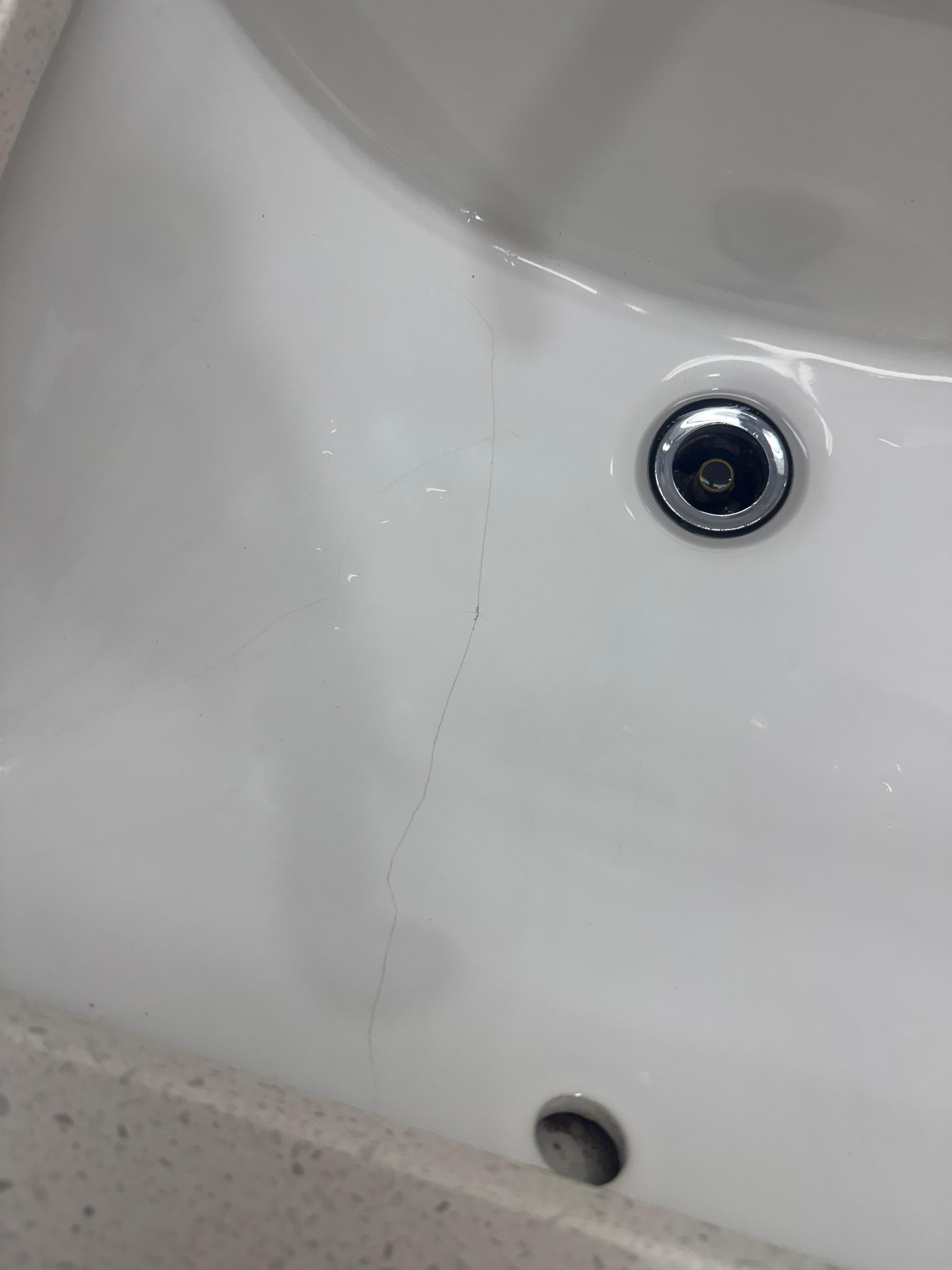 Cracked sink and missing stopper 