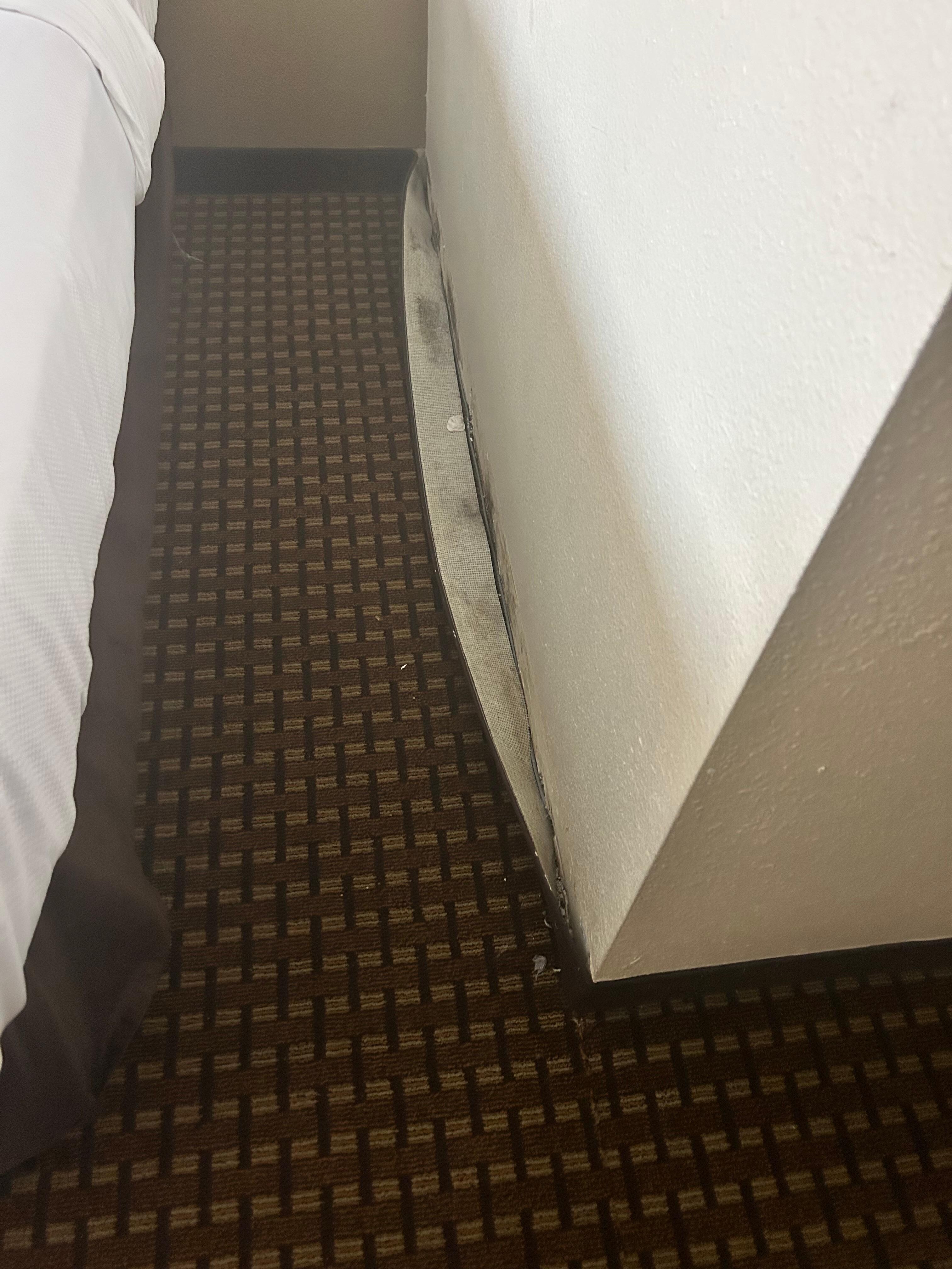 Baseboard not attached to the wall