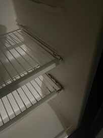 Inside rusty refrigerator