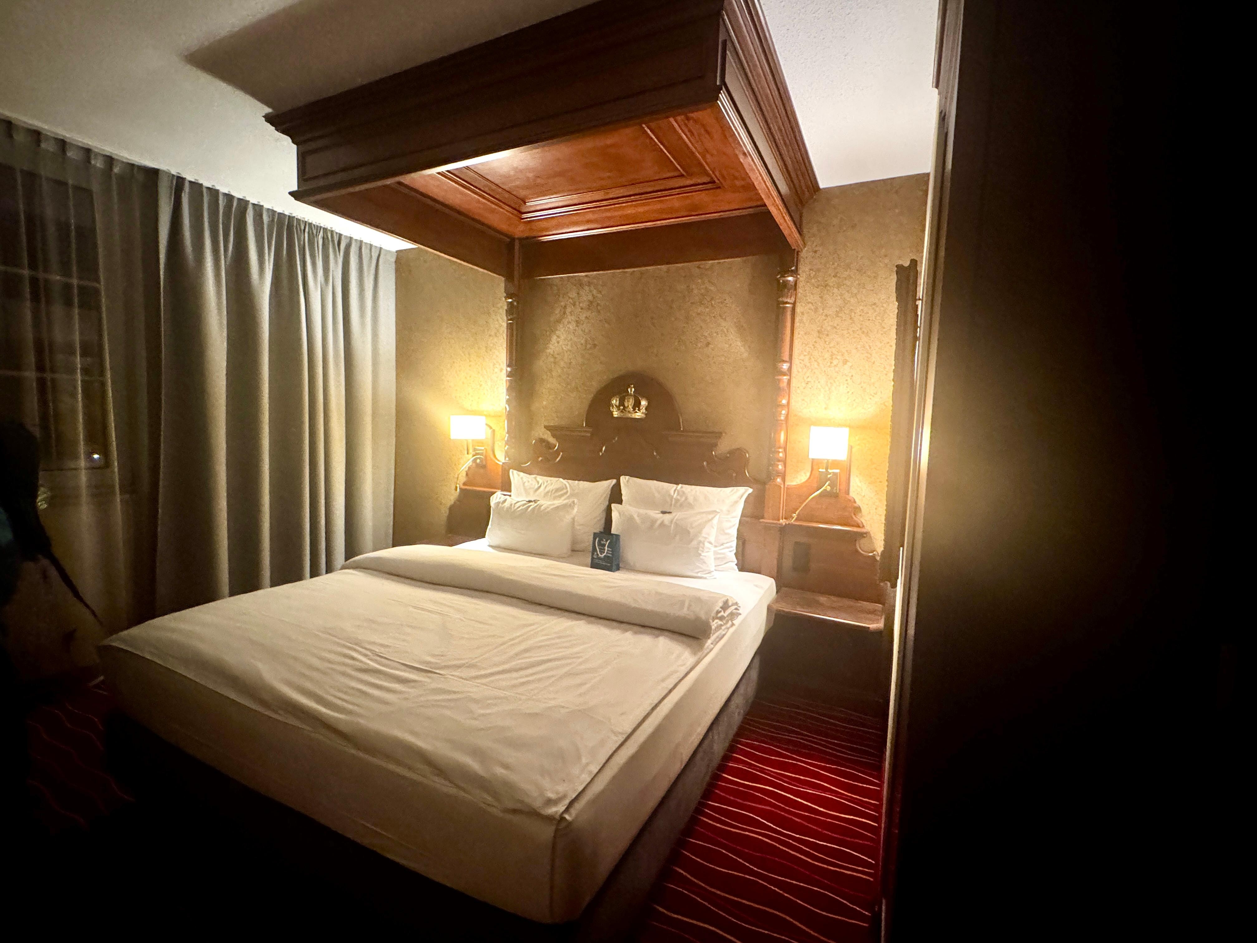 Our room with bed for two. Loved the canopy sty and the little treats on the bed