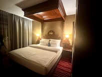 Our room with bed for two. Loved the canopy sty and the little treats on the bed