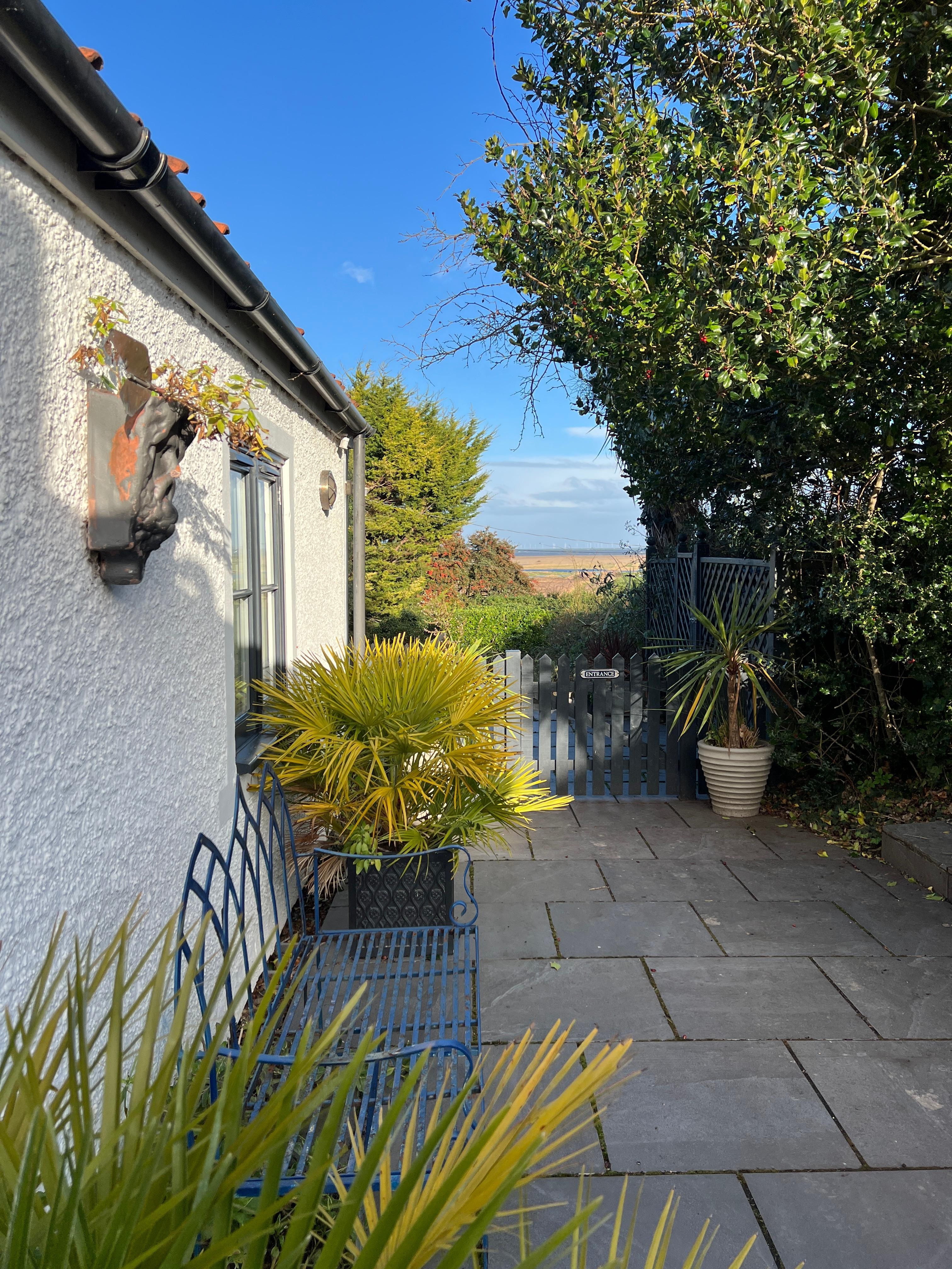 View of the side garden down with the sea in the background