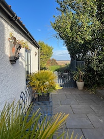 View of the side garden down with the sea in the background