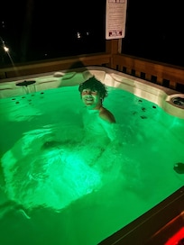 Hot tub on porch, clean and adds great ambiance.