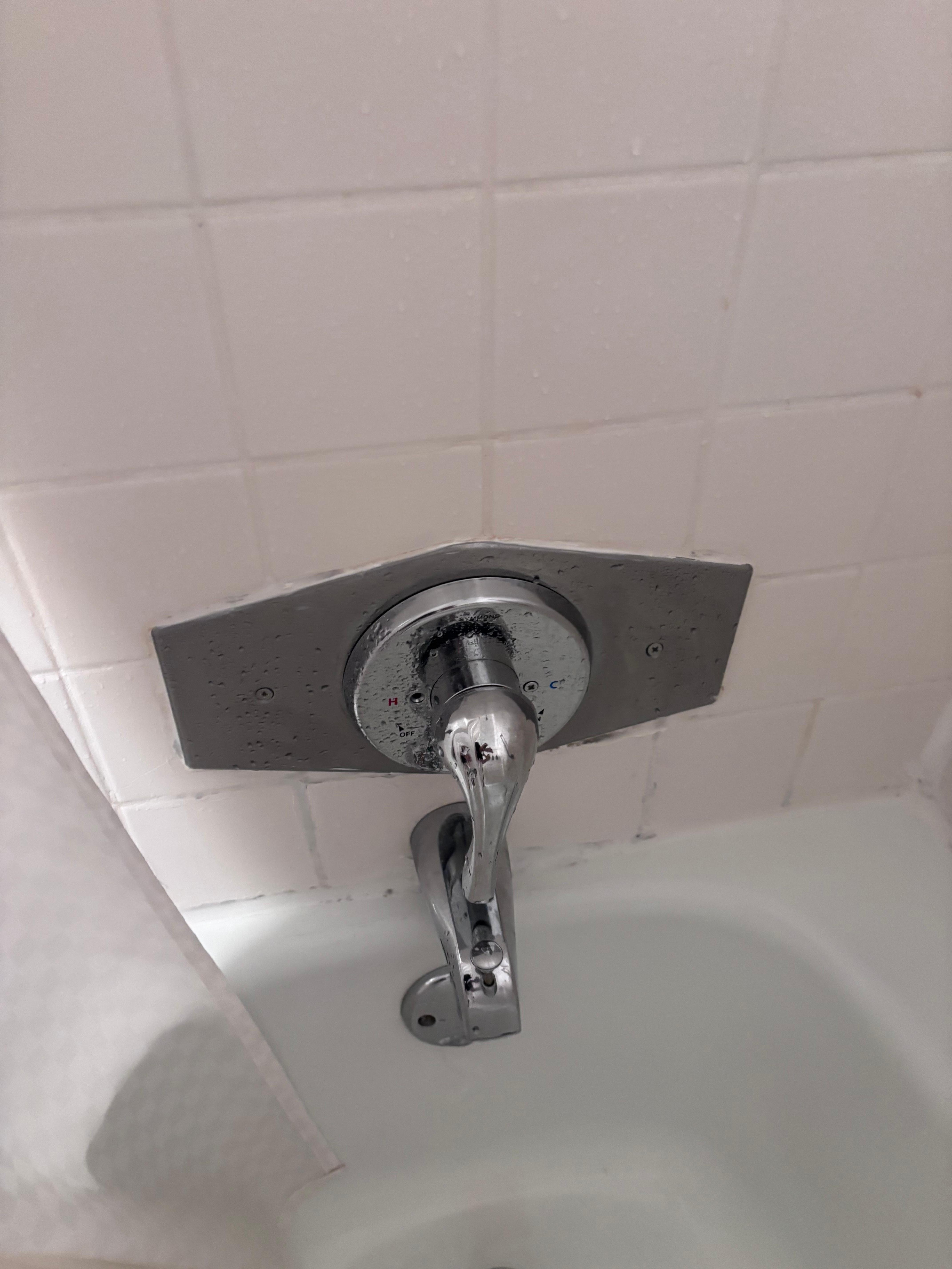 Broken faucet in shower. 