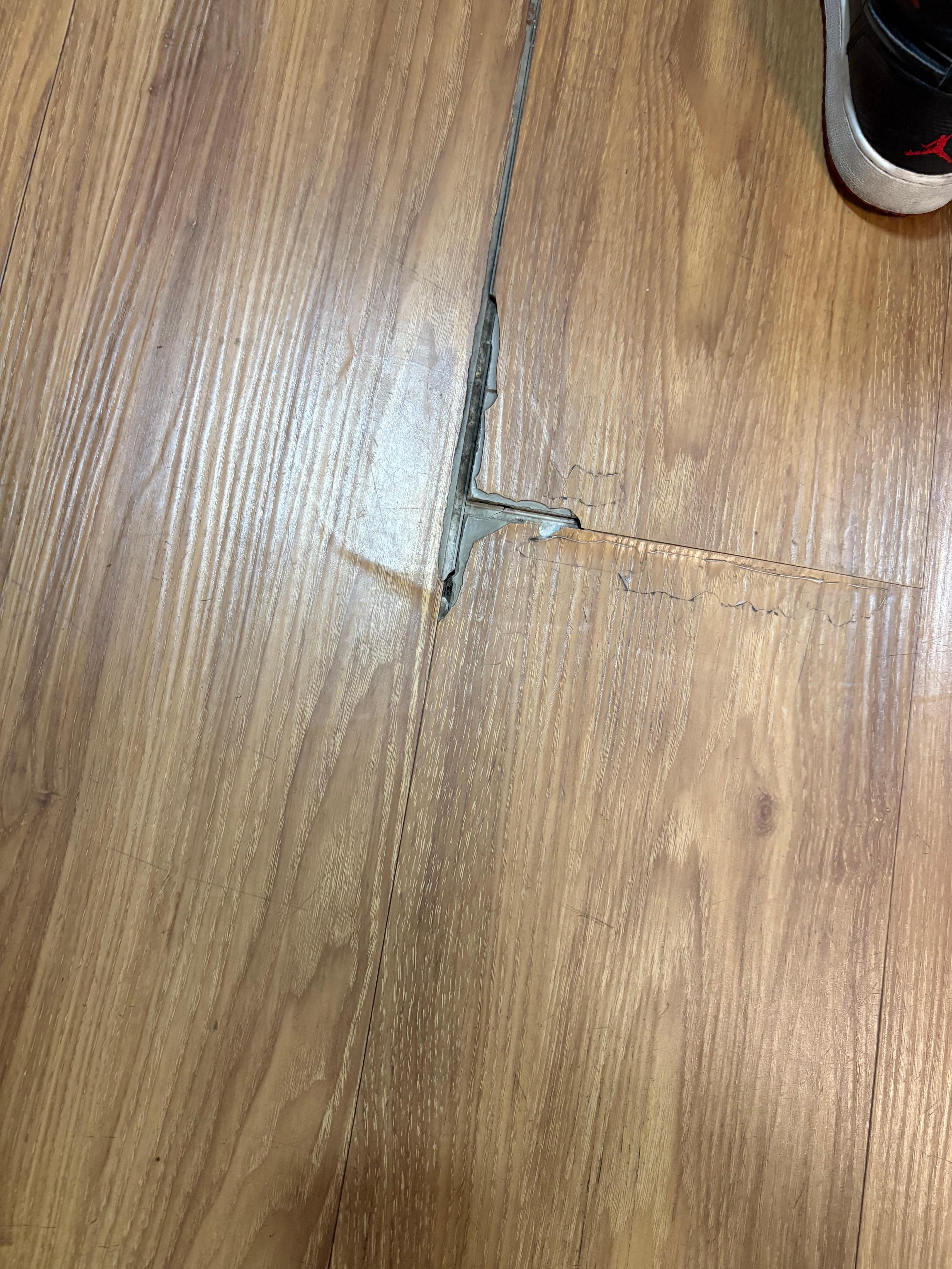 Broken flooring sticking up. 