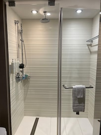 Shower with waterfall shower head and removable shower head.