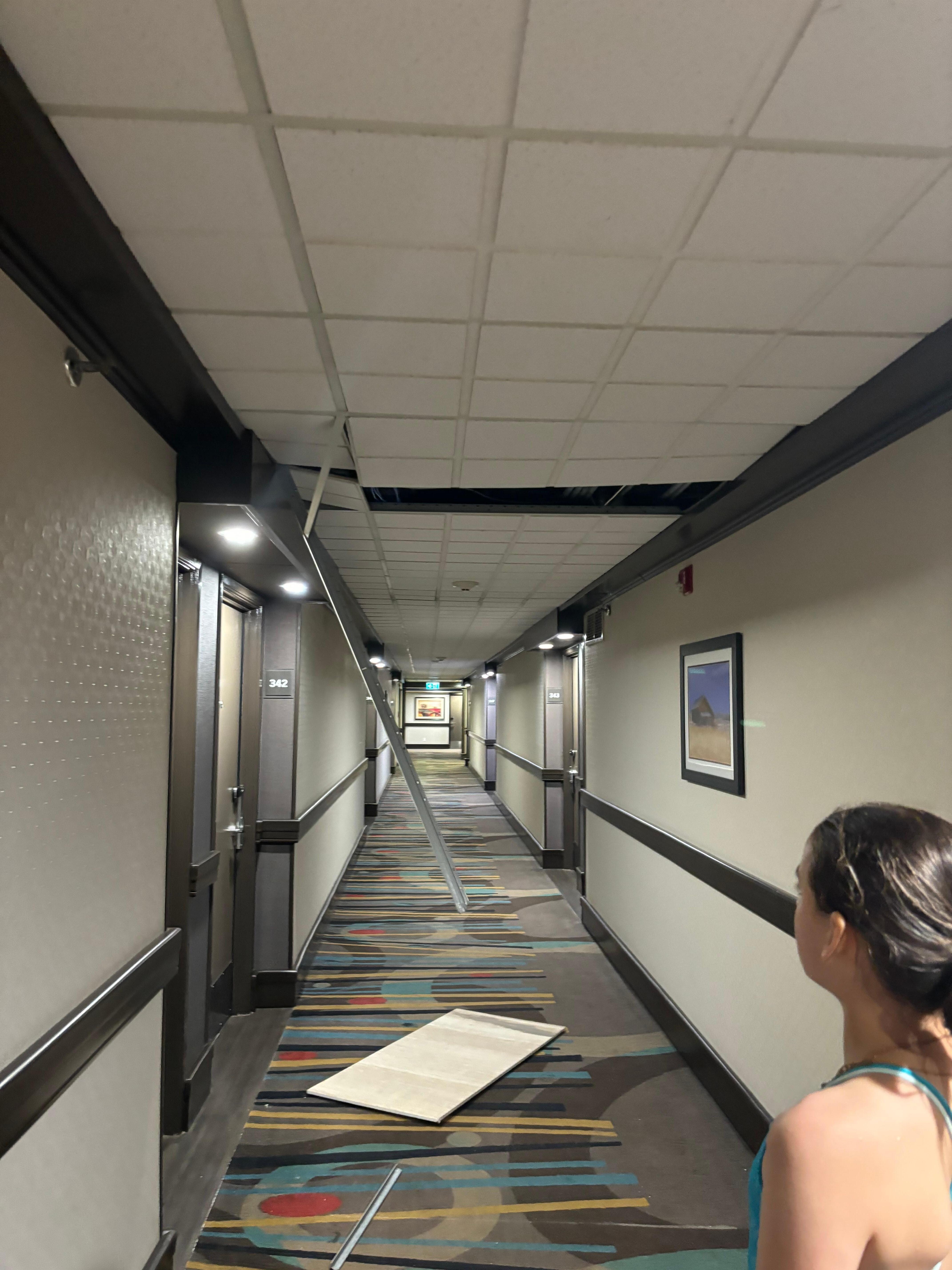 Broken/falling apart roof. Metal hanging down. 
