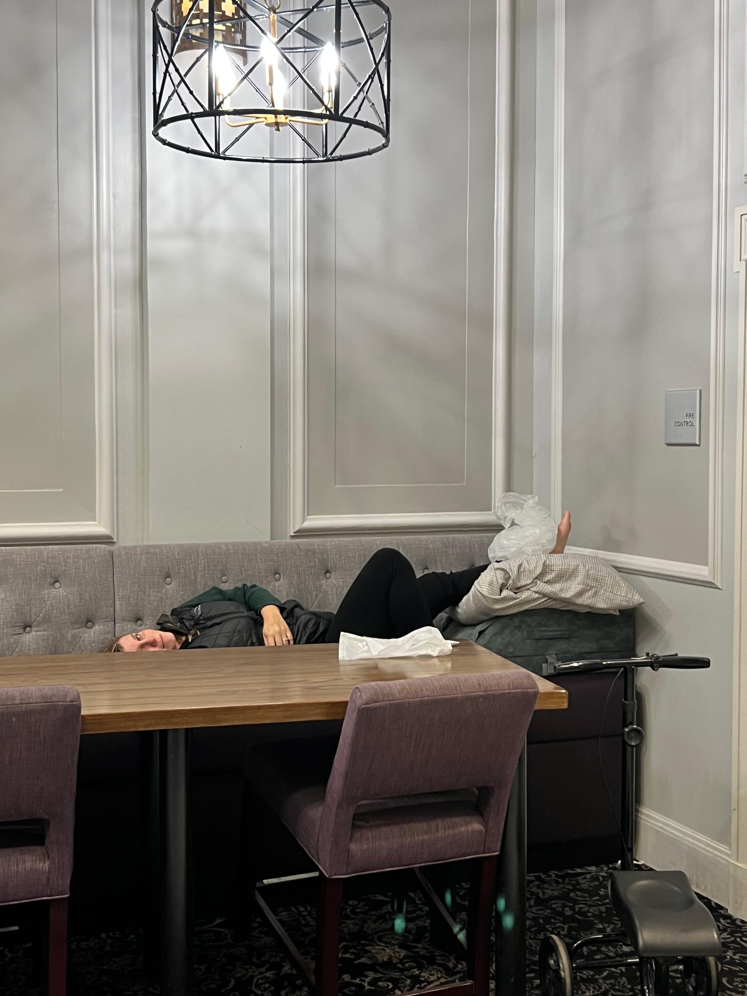 Me trying to elevate my foot on the filthy cushions while waiting for the room. 