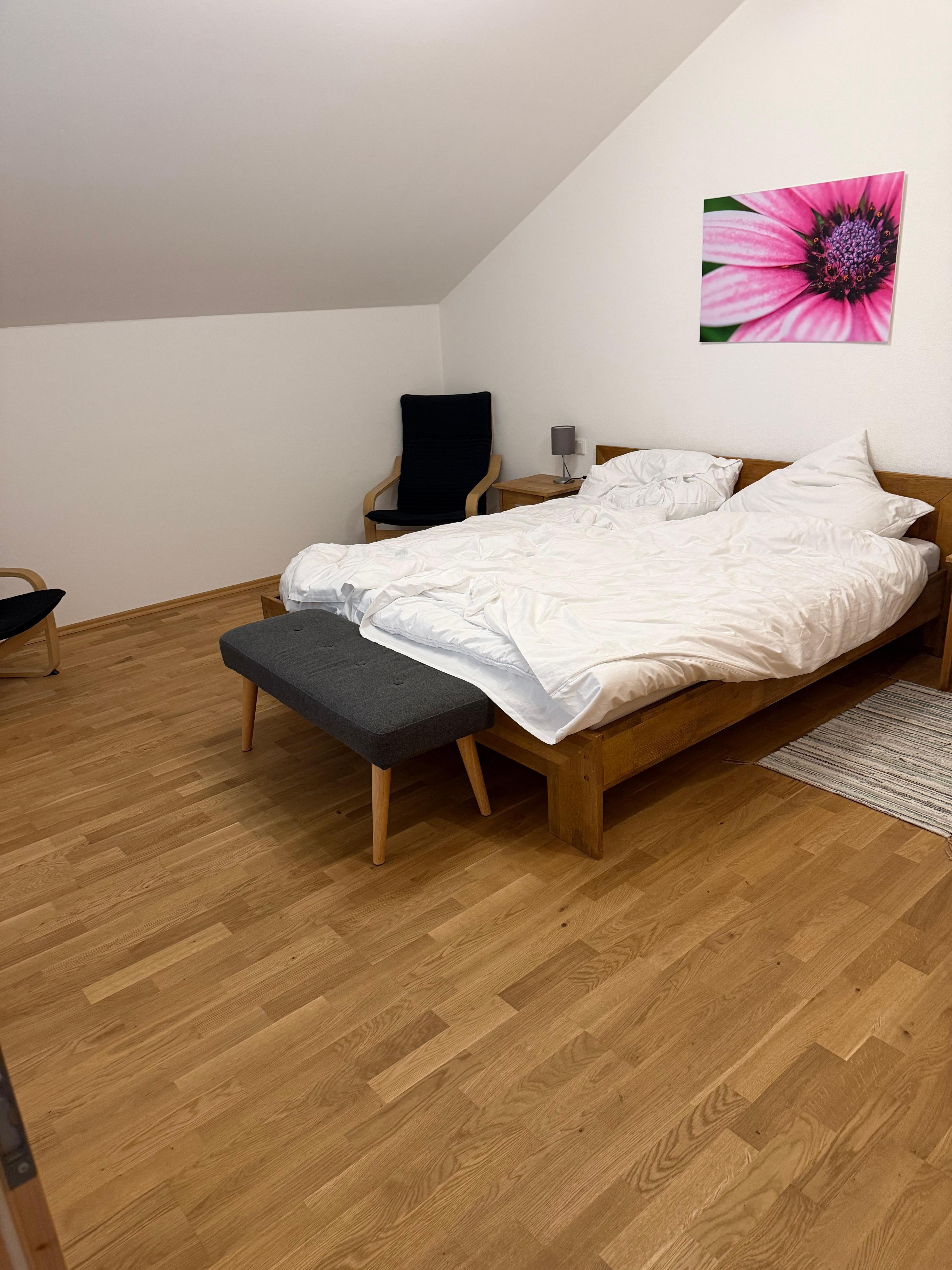 Big master bedroom with comfortable large bed and bedding