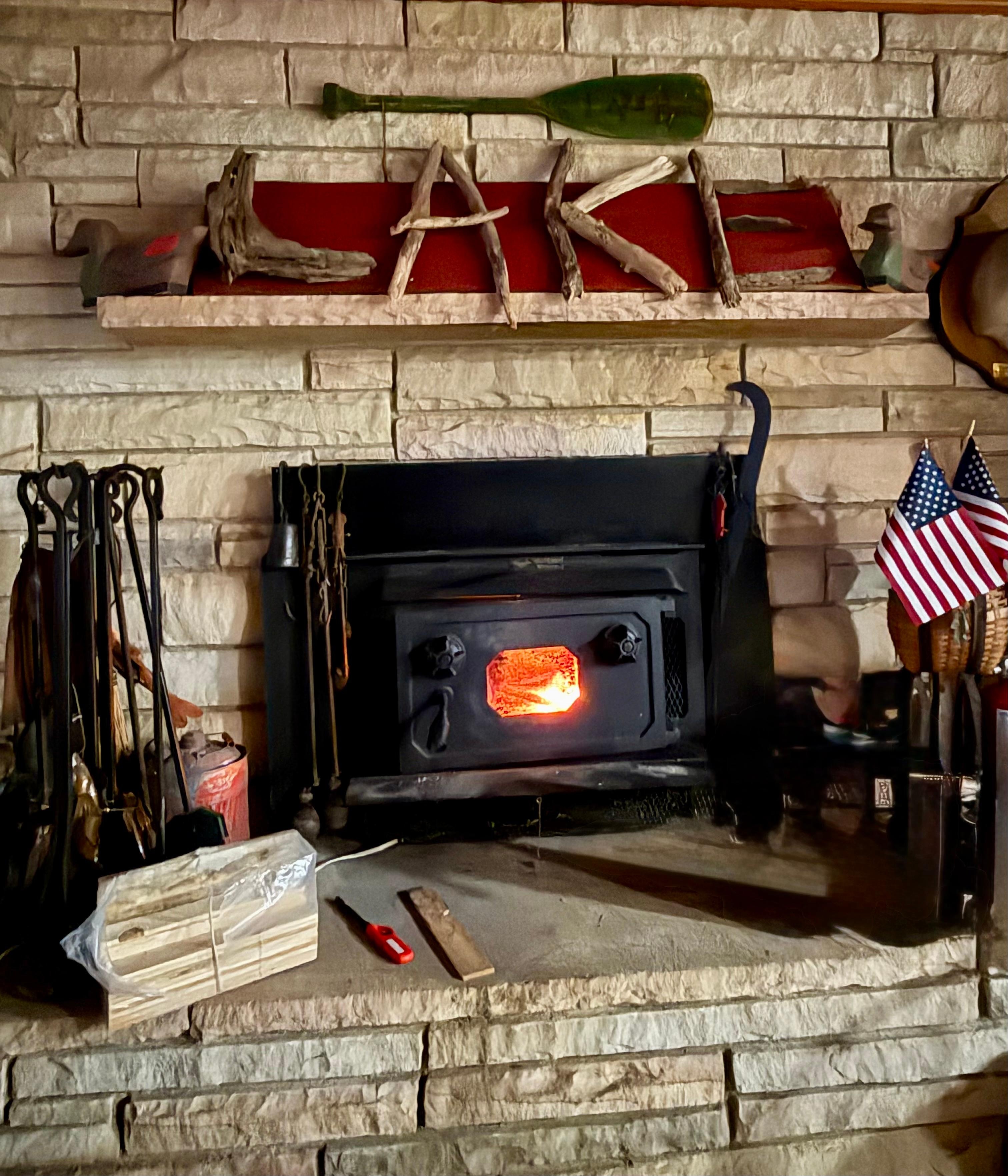 The cozy stone fireplace.