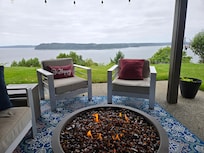 Outdoor seating area with firepit and that amazing view!