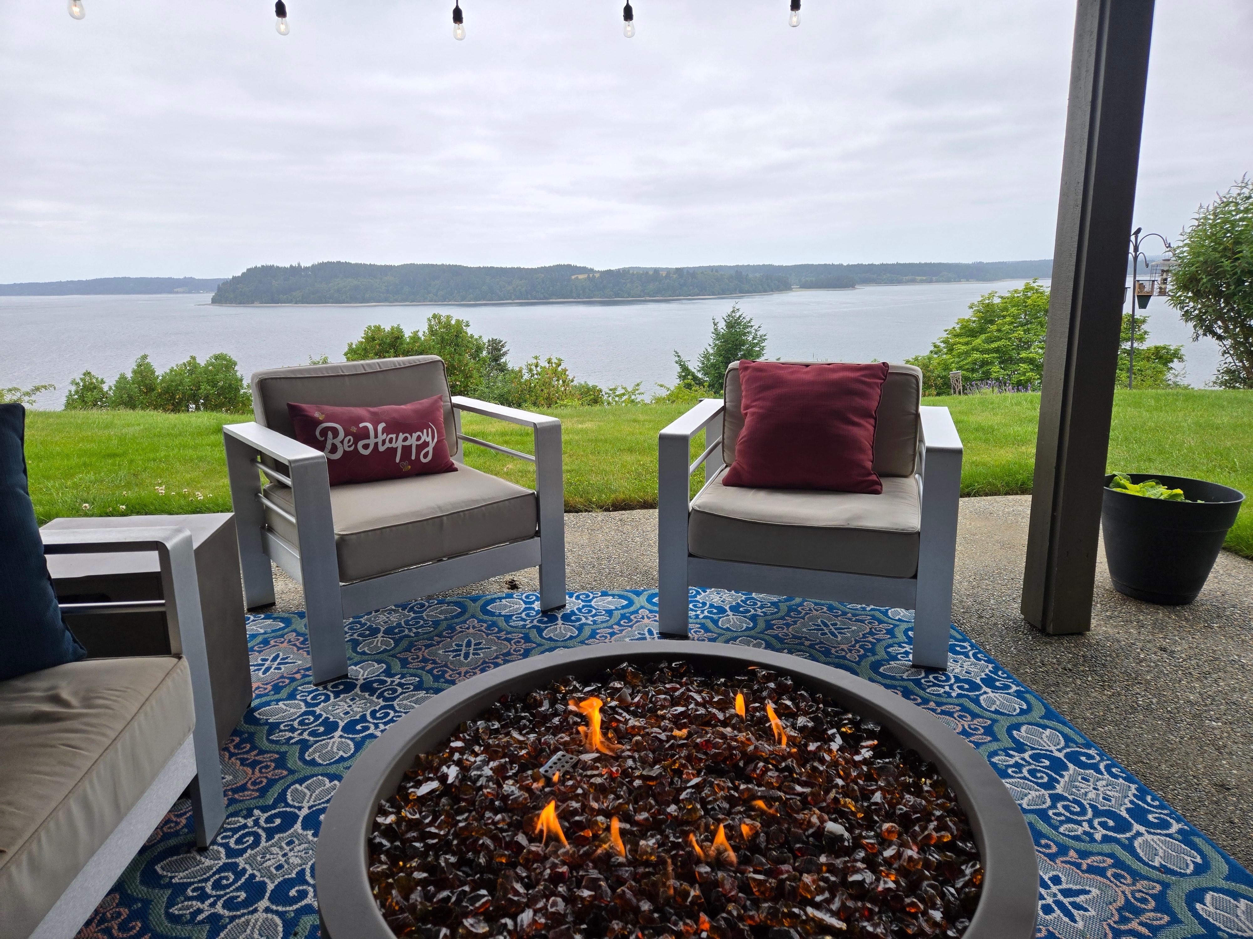 Outdoor seating area with firepit and that amazing view!