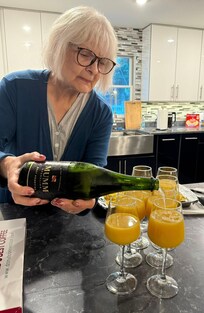 Making Mimosas with the Champaign that Ed gave us!