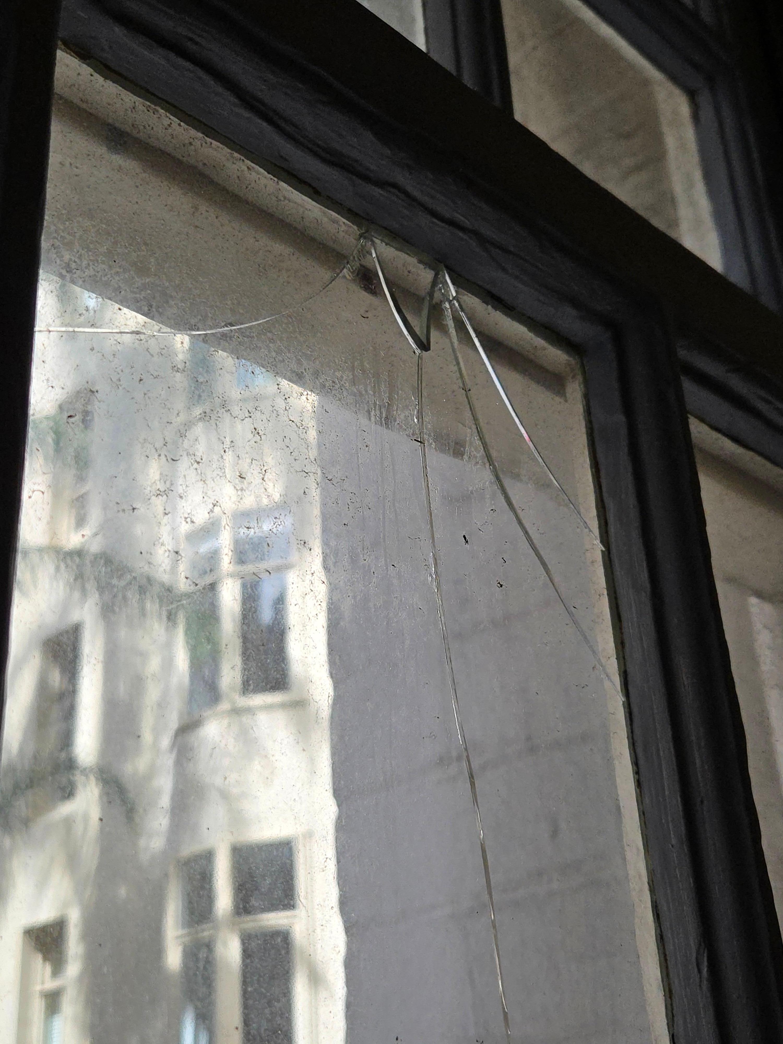 Unsafe broken glass in window
