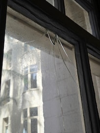 Unsafe broken glass in window