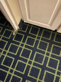 Dirty floor that clearly hadn’t been cleaned. There was someone’s lost earring in sight that could have been vacuumed or picked up.