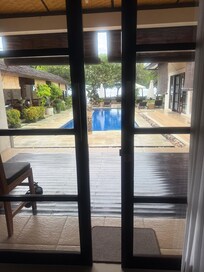 View from 2 bed massive suite VIP room to oool and ocean