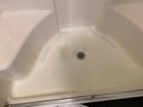 Look at all the repairs on this floor of the shower.