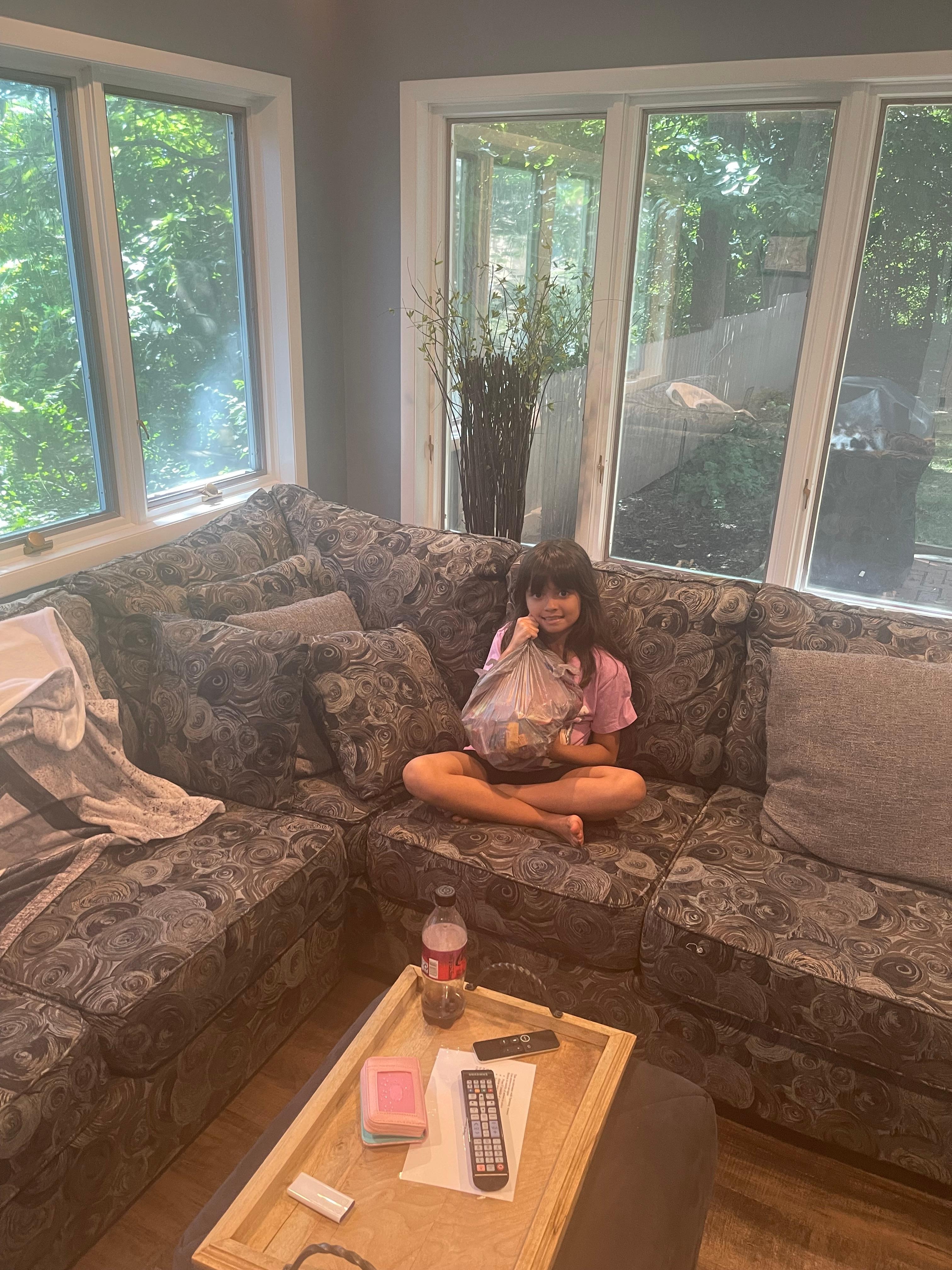 Granddaughter relaxing in the sunroom.  