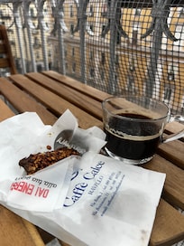 Relaxed, reading a book on the balcony before starting my day.