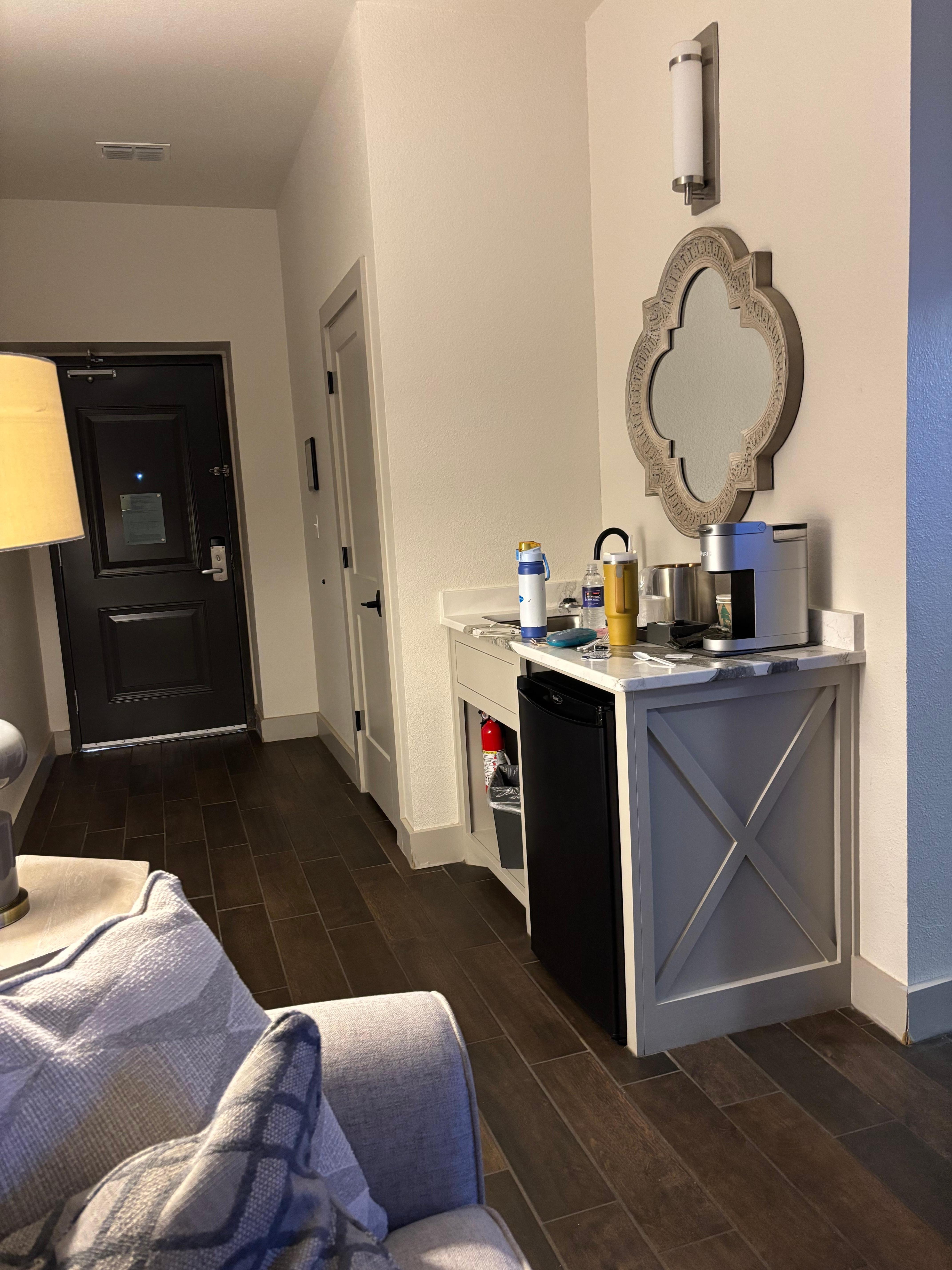 Sink fridge and coffee.