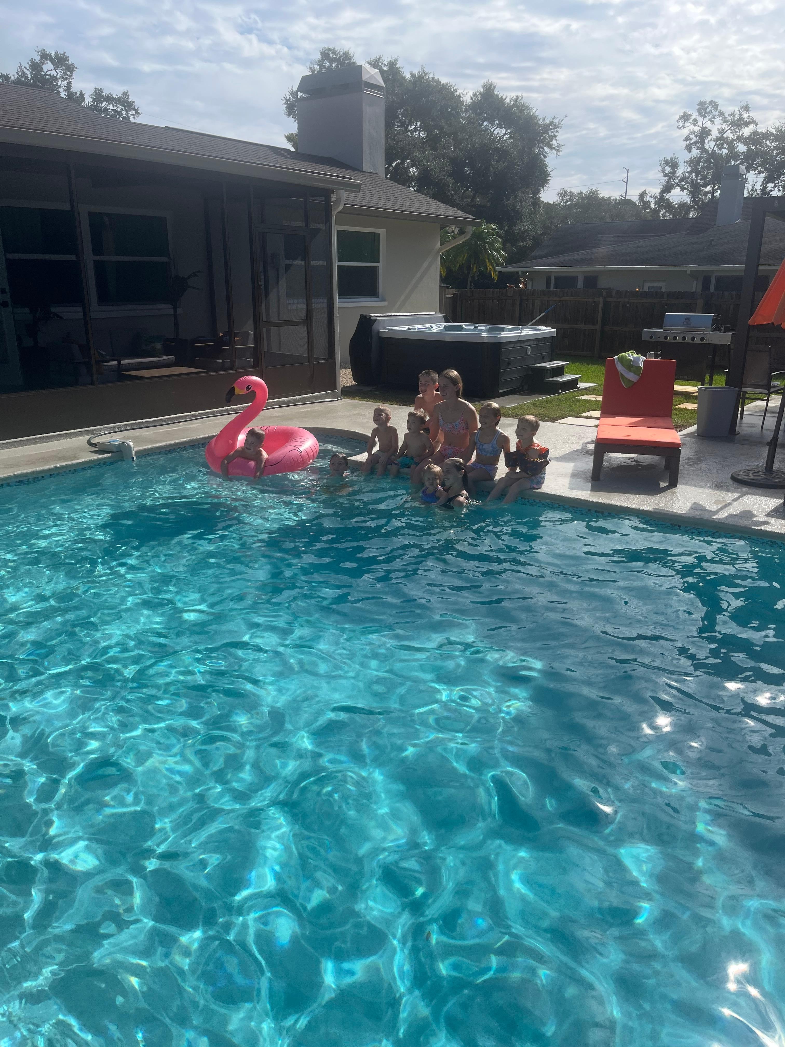 Kids stopped swimming just long enough to take a picture