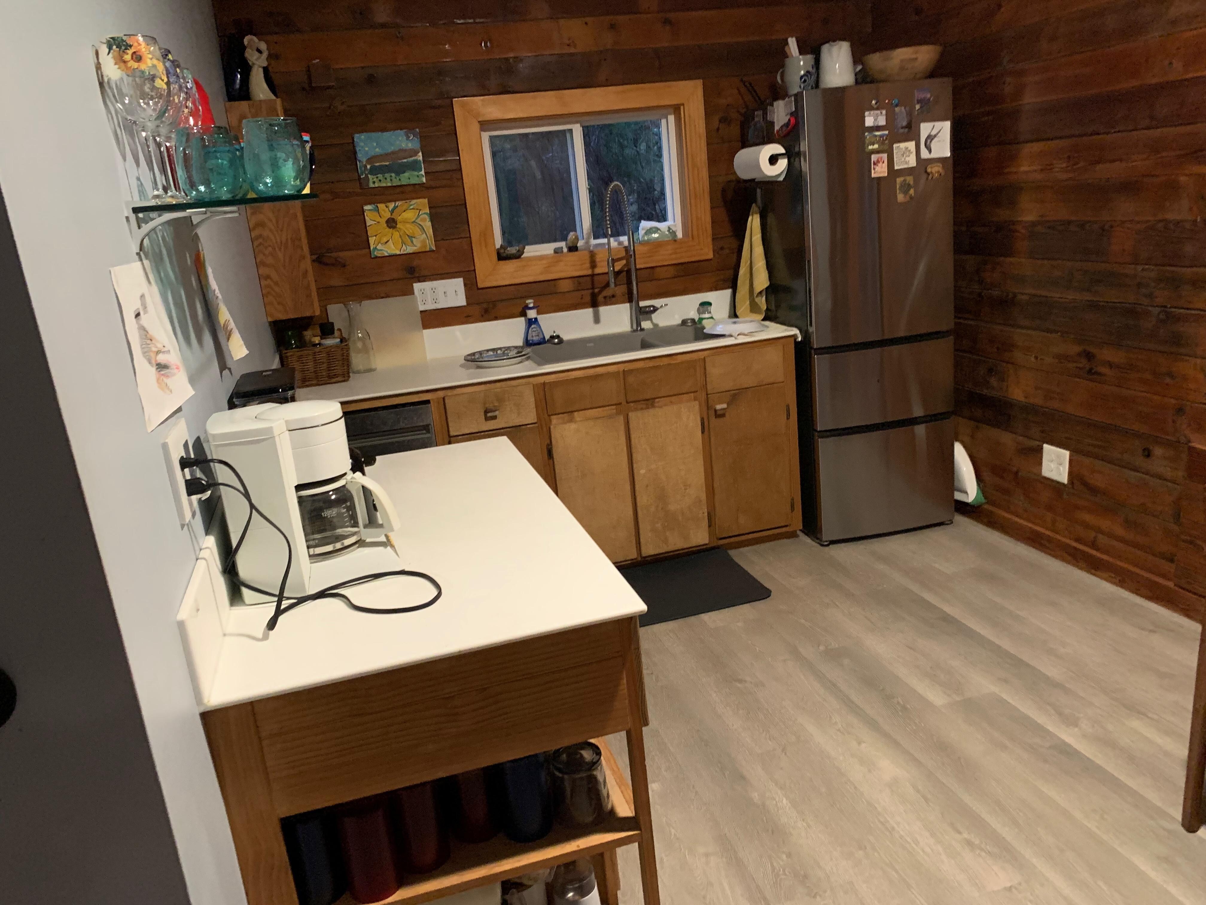 The compact kitchen with the banquet-style eating area is to the immediate right.