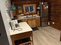 The compact kitchen with the banquet-style eating area is to the immediate right.