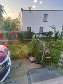 Over grown grass every where and abandoned house next door looks like crack house!