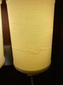 A broken/cracked lamp shade in our room.