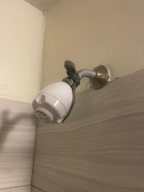 Neither shower head functioned correctly