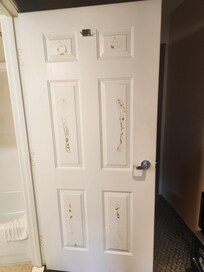 Mirror pulled off bathroom door anddried gobs of glue