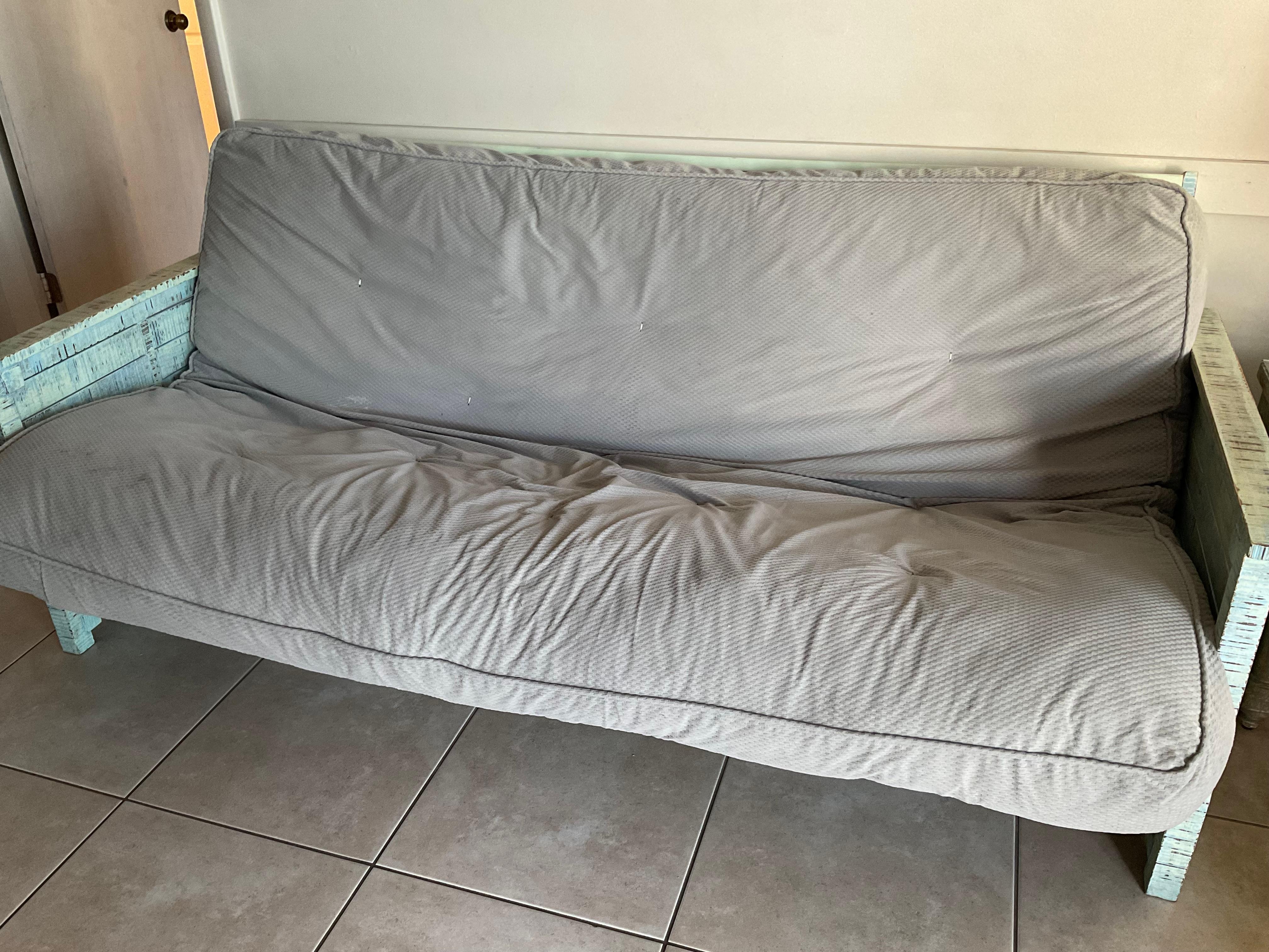 A dirty worn out futon. A far cry from the pictures we saw when we booked