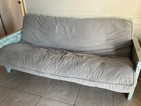 A dirty worn out futon. A far cry from the pictures we saw when we booked