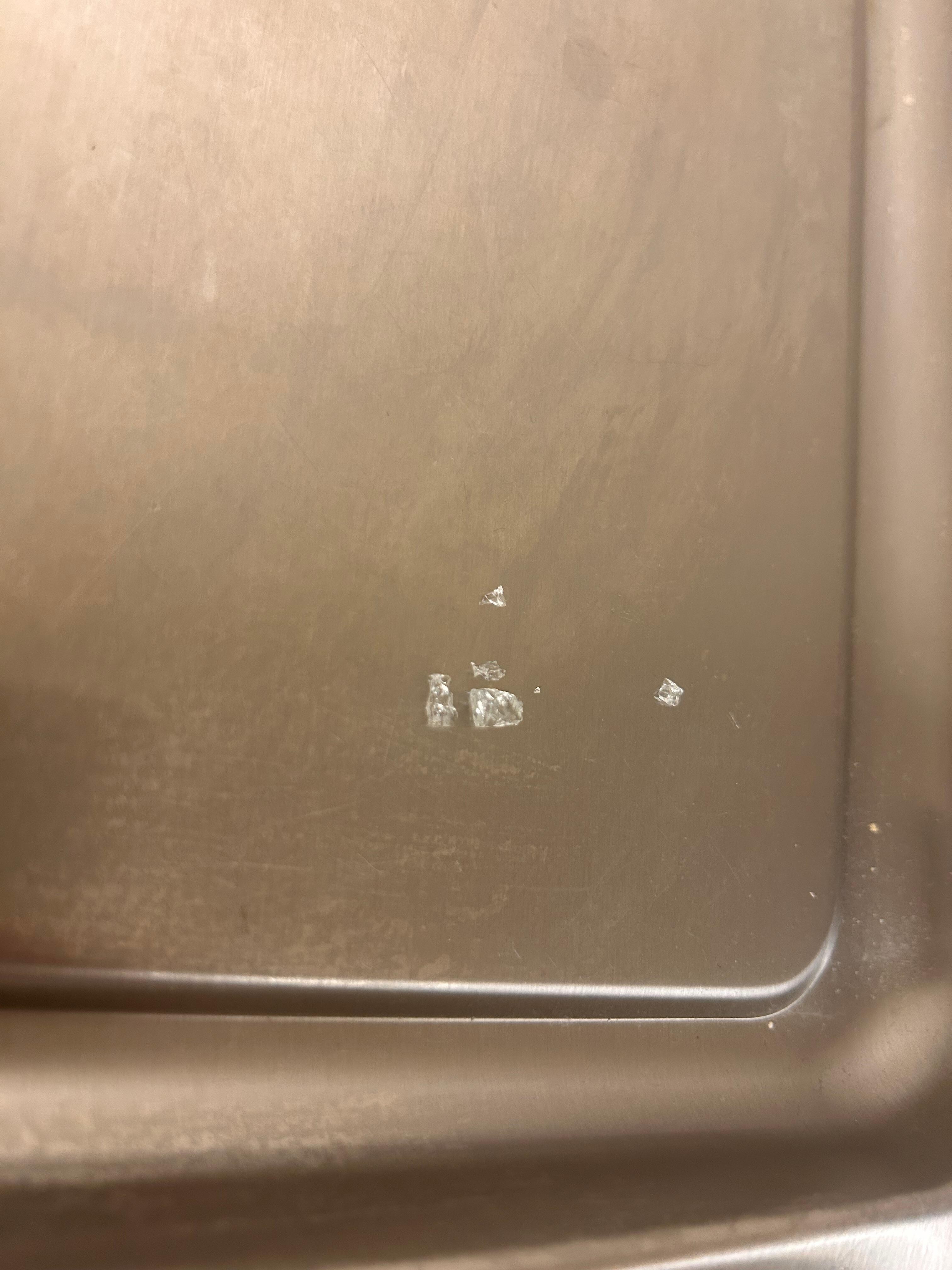 Broken glass from the floor. 