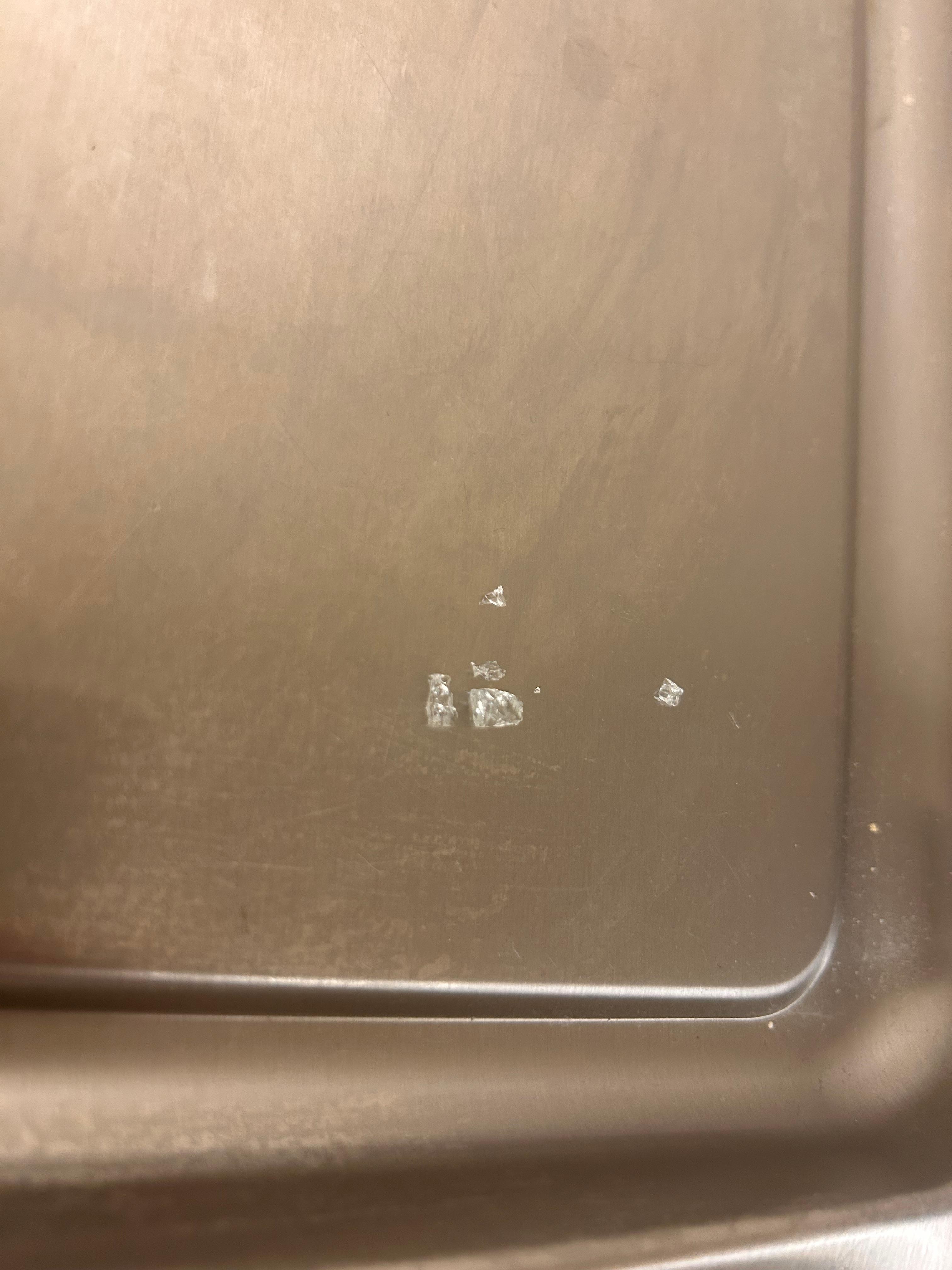 Broken glass from the floor.
