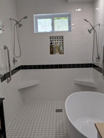 Soaking tub and double showerhead bathroom.