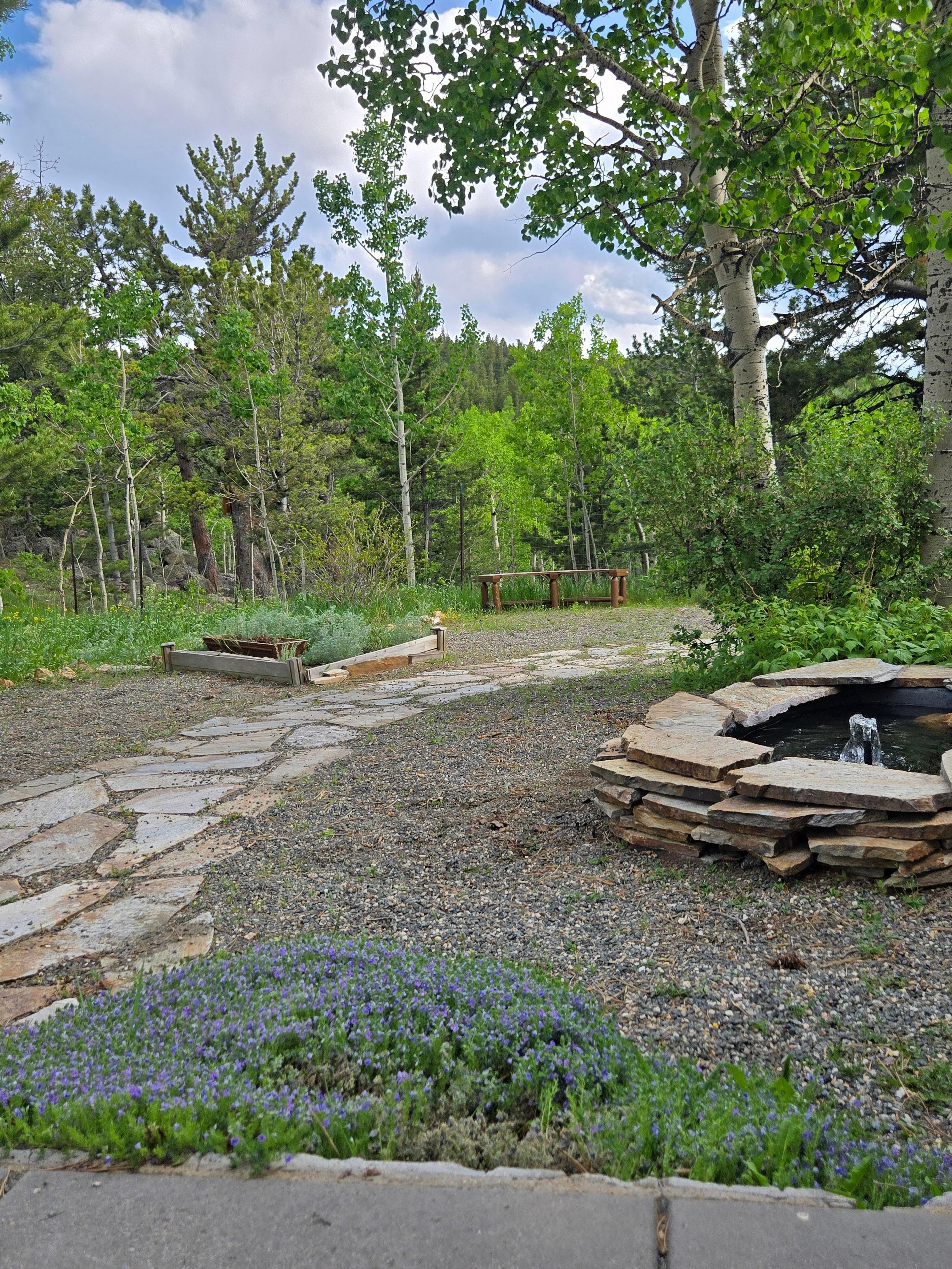fenced yard w peaceful fountain
