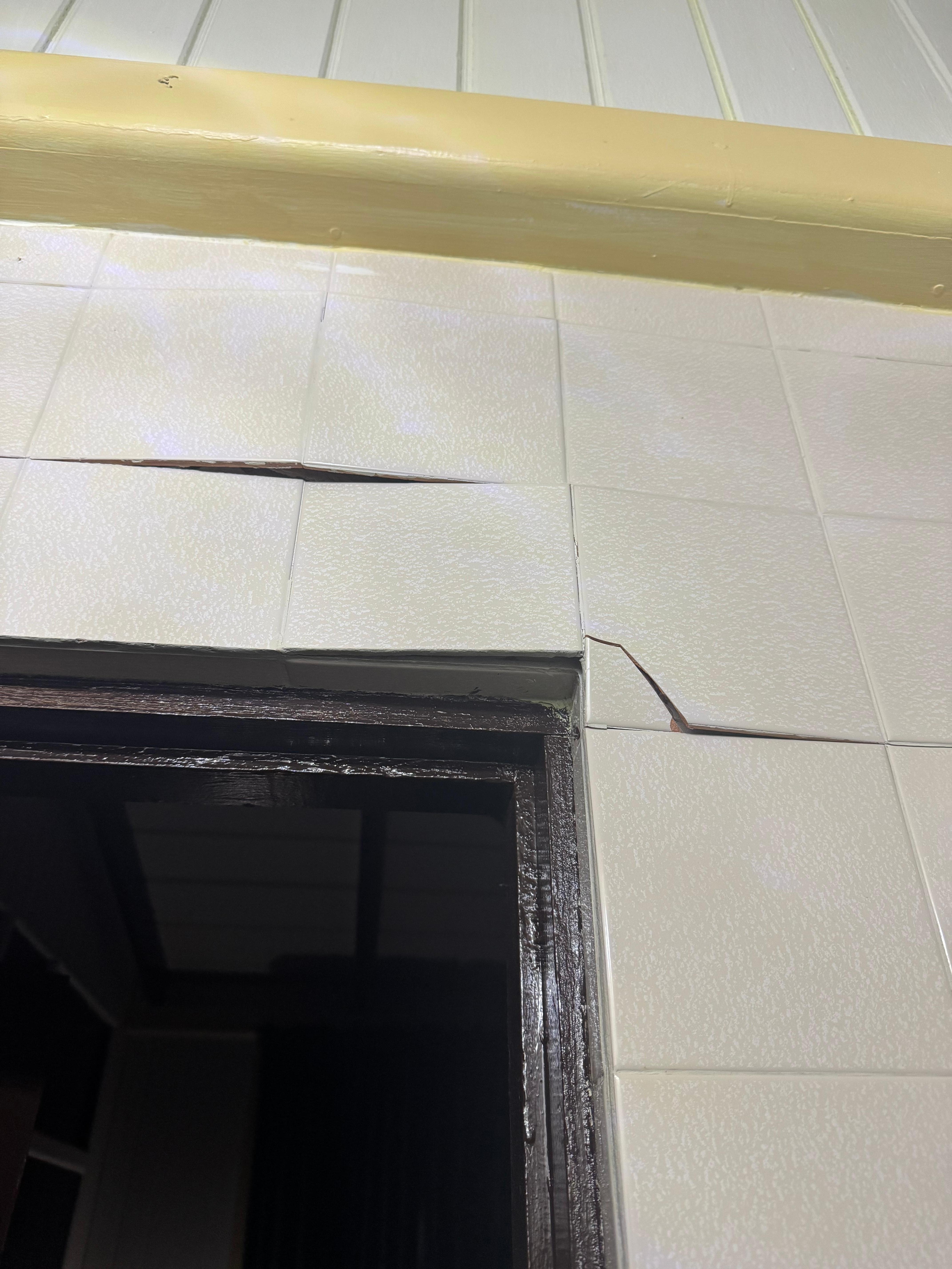 Tiles breaking off the wall 