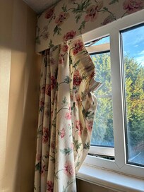 Curtains hanging off rails, I would have re-hung them but was afraid to touch them, given the state of the room.